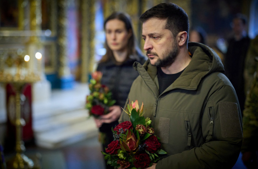 Ukraine's President Volodymyr Zelensky and Finnish Prime Minister Sanna Marin attend a memorial service for Dmytro ''Da Vinci'' Kotsiubailo, a former volunteer and serviceman who was killed in a fight against Russian troops in the frontline town of Bakhmut, March 10, 2023. (credit: Ukrainian Presidential Press Service/Handout via REUTERS)