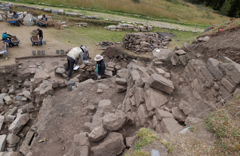 Archaeologists work on the a new discovery of a network of passageways under a more than 3,000 year-old temple in the Peruvian Andes, in Ancash, Peru, May 27, 2022. (photo credit: Antamina Communications Office/Handout via REUTERS)