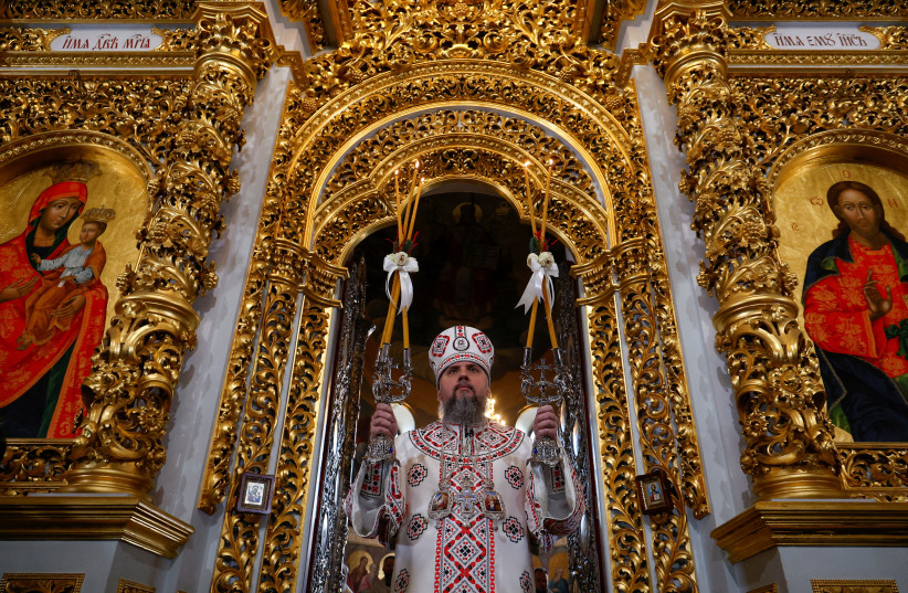  Metropolitan Epifaniy I, head of the Orthodox Church of Ukraine, leads for the first time a Christmas service inside Uspenskyi (Holy Dormition) Cathedral, at the compound of the Kyiv Pechersk Lavra monastery in Kyiv, Ukraine January 7, 2023. (credit: REUTERS/VALENTYN OGIRENKO)