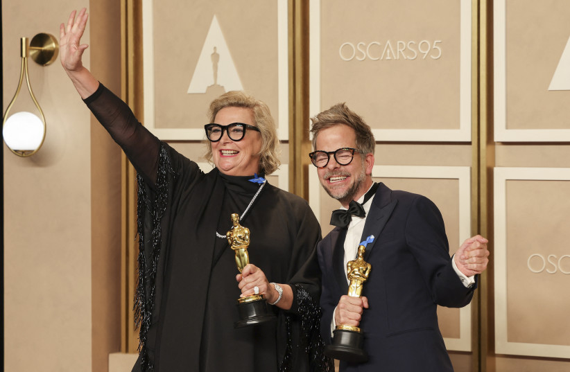  Christian M. Goldbeck and Ernestine Hipper pose with their Oscars for Best Production Design for ''All Quiet on the Western Front'' in the Oscars photo room at the 95th Academy Awards in Hollywood, Los Angeles, California, US, March 12, 2023.   (credit: REUTERS/MIKE BLAKE)