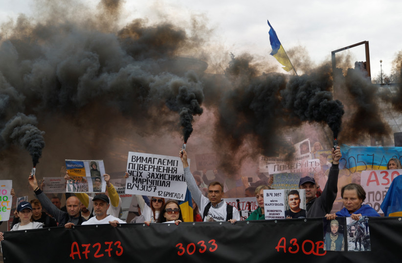  Relatives of Ukrainian prisoners of war (POWs) attend a rally demanding to speed up their release from a Russian captivity, amid Russia's attack on Ukraine, at the Independence Square in Kyiv, Ukraine October 1, 2022.  (photo credit: REUTERS/VALENTYN OGIRENKO)