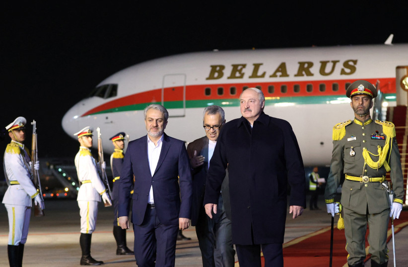  Belarusian President Alexander Lukashenko and Iranian Minister of Industry, Mining and Trade Seyyed Reza Fatemi Amin attend a welcoming ceremony at an airport in Tehran, Iran, March 12, 2023.  (credit: BelTA/Handout via REUTERS )