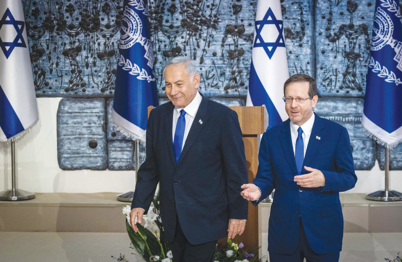  PRESIDENT ISAAC Herzog and Prime Minister Benjamin Netanyahu chat at the President’s Residence in Jerusalem after the president handed Netanyahu a mandate to form a new government, in November. (photo credit: OLIVIER FITOUSSI/FLASH90)