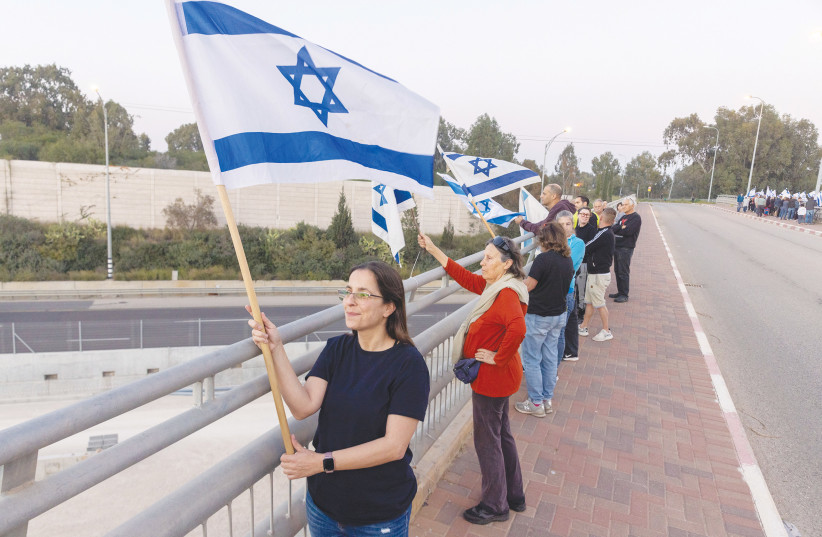  THE DEMONSTRATORS’ use of flags and their reference to the Declaration of Independence is spot on, the writer asserts.  (photo credit: YOSSI ALONI/FLASH90)