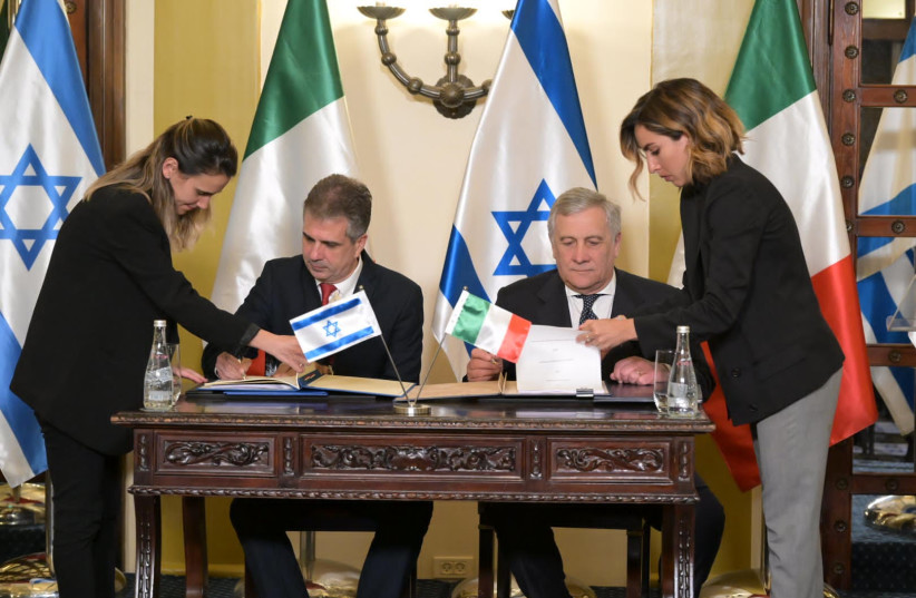 Foreign Minister Eli Cohen seen with his Italian counterpart on March 13, 2023 (credit: SHLOMI AMSALEM/GPO)