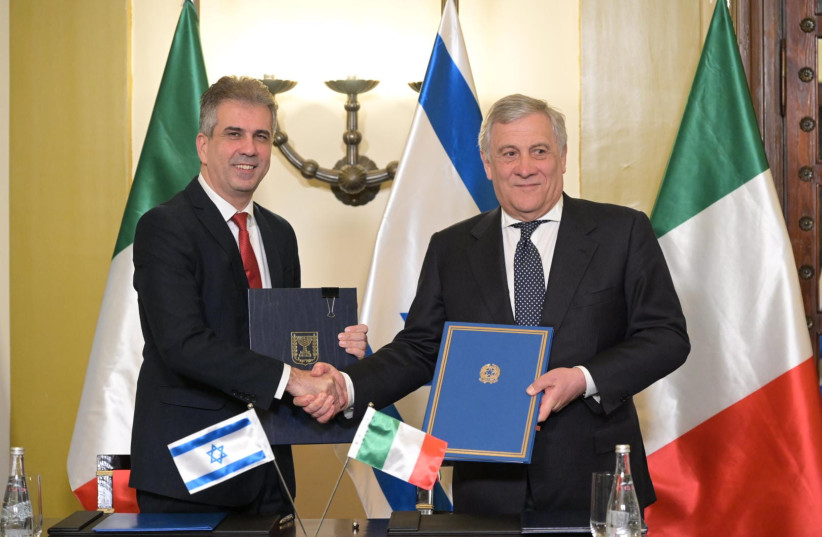 Foreign Minister Eli Cohen seen with his Italian counterpart on March 13, 2023 (photo credit: SHLOMI AMSALEM/GPO)