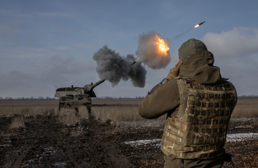 Ukrainian army from the 43rd Heavy Artillery Brigade fire the German howitzer Panzerhaubitze 2000, called Tina by the unit, amid Russia's attack on Ukraine, near Bahmut, in Donetsk region, Ukraine, February 5, 2023. (photo credit: MARKO DJURICA/REUTERS)