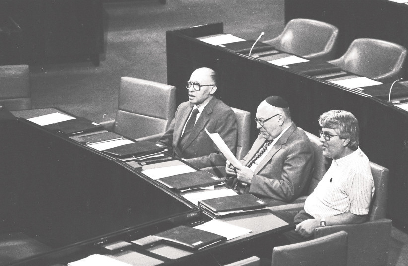  LEFT TO right: Then-prime minister Menachem Begin sits in the Knesset plenum alongside cabinet ministers Yosef Burg and David Levy, in 1983. The Right’s stunning victory in 1977 caused immense fear and alarm on the Left (photo credit: YOSSI ZAMIR/FLASH90)