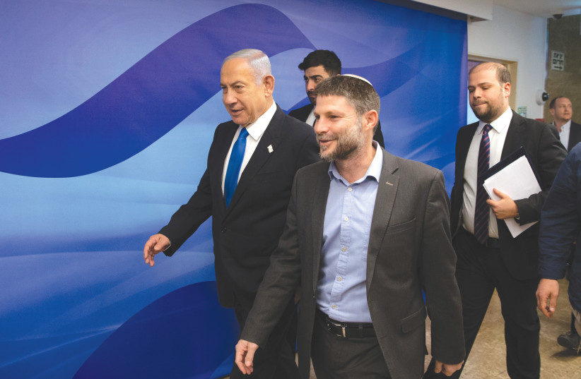  FINANCE MINISTER and Minister in the Defense Ministry Bezalel Smotrich arrives for a cabinet meeting, as Prime Minister Benjamin Netanyahu follows him, at the Prime Minister’s Office in Jerusalem, last month. (photo credit: ALEX KOLOMOISKY/FLASH90)