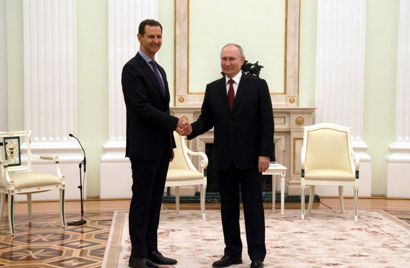  Russian President Vladimir Putin and Syrian President Bashar al-Assad shake hands during a meeting at the Kremlin in Moscow, Russia, March 15, 2023. (credit: Sputnik/Vladimir Gerdo/Pool via REUTERS)