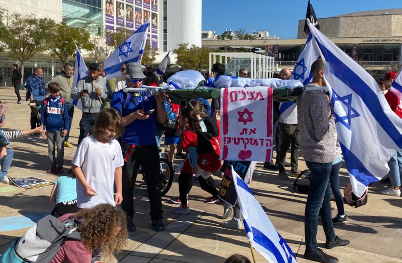  Children and parents protest at HaBima Square in Tel Aviv for the third ''Day of Disruption'' against the judicial reforms on March 16, 2023.  (credit: AVSHALOM SASSONI/MAARIV)