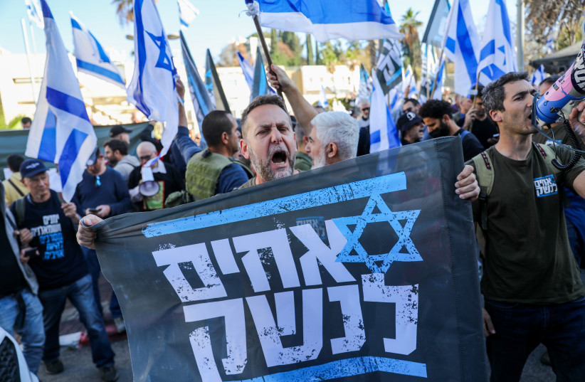  Israeli reserve soldiers and activists protest against the Israeli government's planned judicial overhaul, in the city of Bnei Brak, March 16, 2023 (credit: FLASH90)