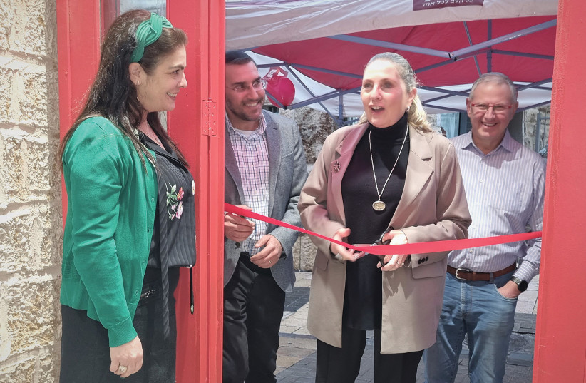  MICHAL HERZOG cuts the ribbon at Haboydem as Eris and Guy Avihod and Elie Lederman (right) look on. (photo credit: SHARON ALTSHUL)