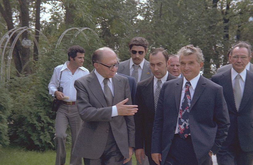  THEN-PRIME MINISTER Menachem Begin and then-Romanian president Nicolae Ceausescu walk in the garden of the presidential residence near Bucharest, in August 1977.  (photo credit: Moshe Milner/GPO)