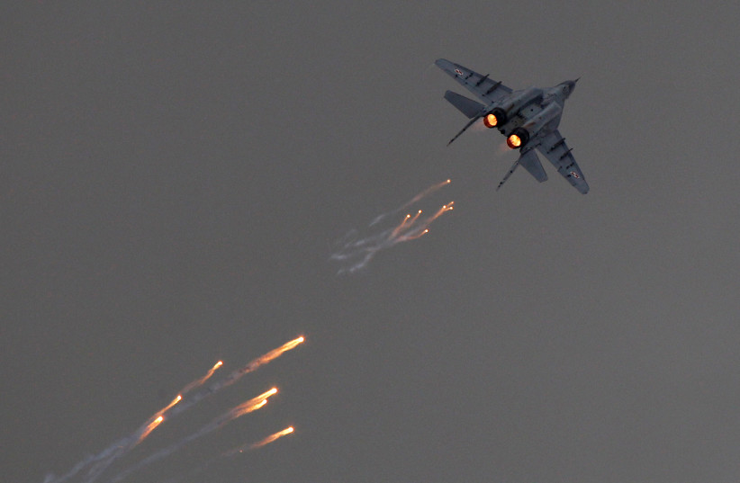  A Polish Air Force MiG-29 aircraft fires flares during a performance at the Radom Air Show at an airport in Radom August 24, 2013. (photo credit: KACPER PEMPEL/REUTERS)
