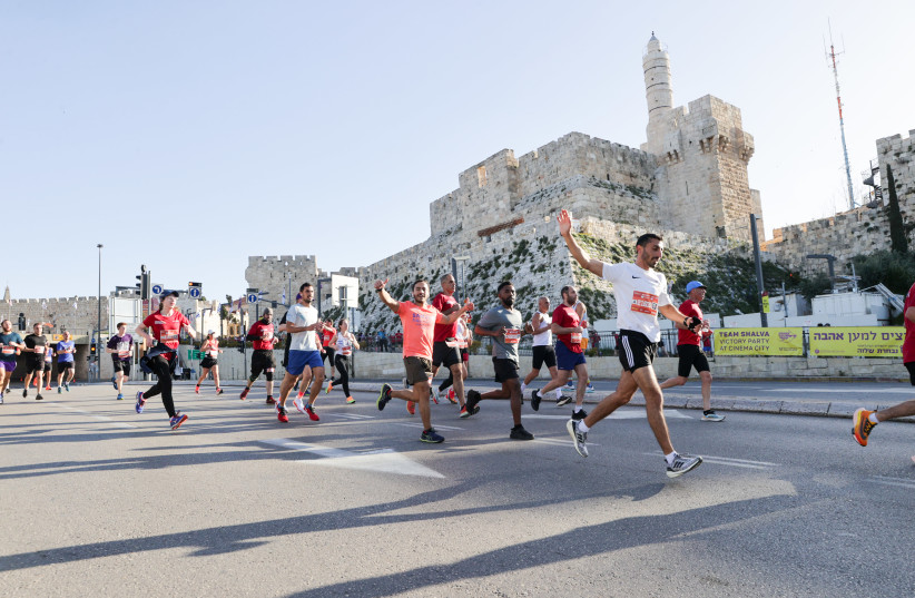 Jerusalem Marathon participants are seen running on March 17, 2023 (credit: Sportphotography)