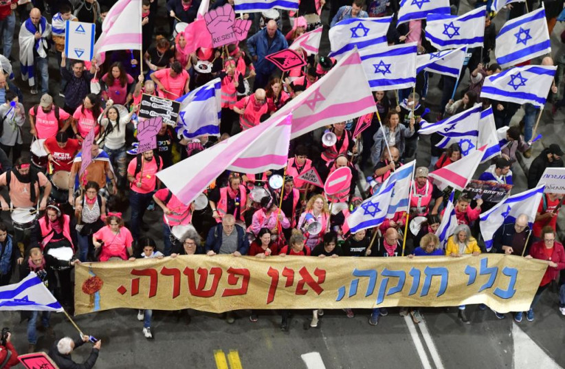  Israelis protest against the Israeli government's planned judicial overhaul in Tel Aviv on March 18, 2023 (credit: AVSHALOM SASSONI)