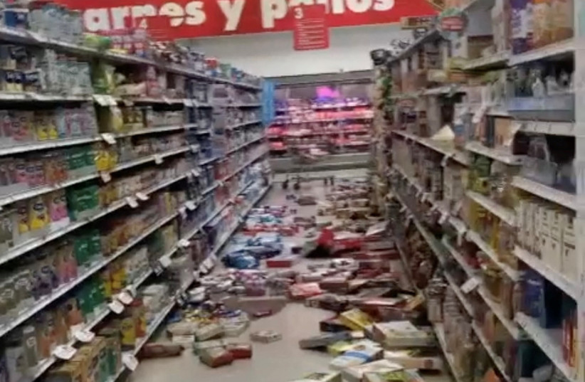 Groceries are seen on the floor of a grocery store following an earthquake in Guayaquil, Ecuador March 18, 2023, in this still image from a video obtained from social media. (credit: GENESIS CHEILLADA JARAMILLO/VIA REUTERS)