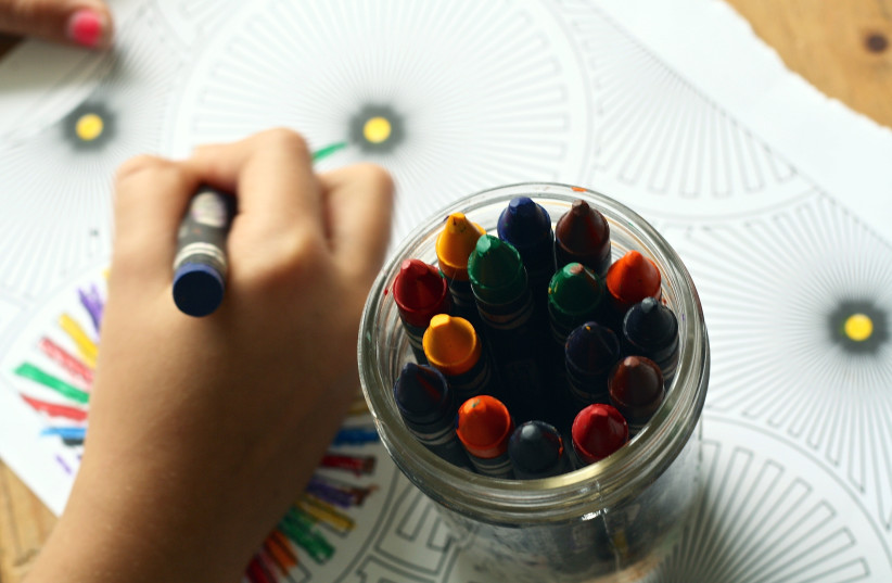  What does your child's favorite color say about them? (illustrative image of child drawing with crayons) (credit: PEXELS)