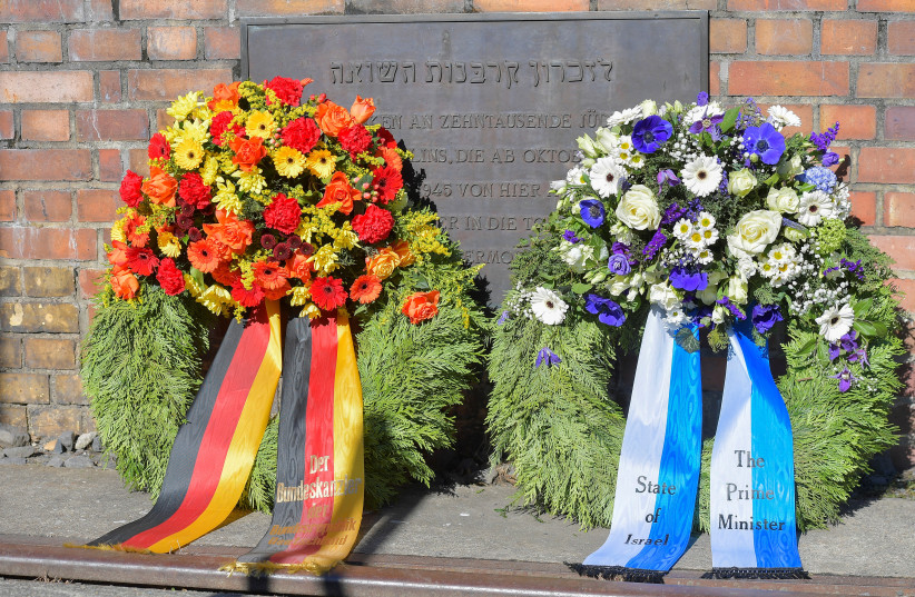 Wreaths are placed before Israeli Prime Minister Benjamin Netanyahu along with German Chancellor Olaf Scholz visit Platform 17 (Gleis 17), the memorial to commemorate those who were deported to the death camps by Deutsche Reichsbahn trains in 1941-1945, Berlin, March 16, 2023. (credit: REUTERS/MATTHIAS RIETSCHEL)