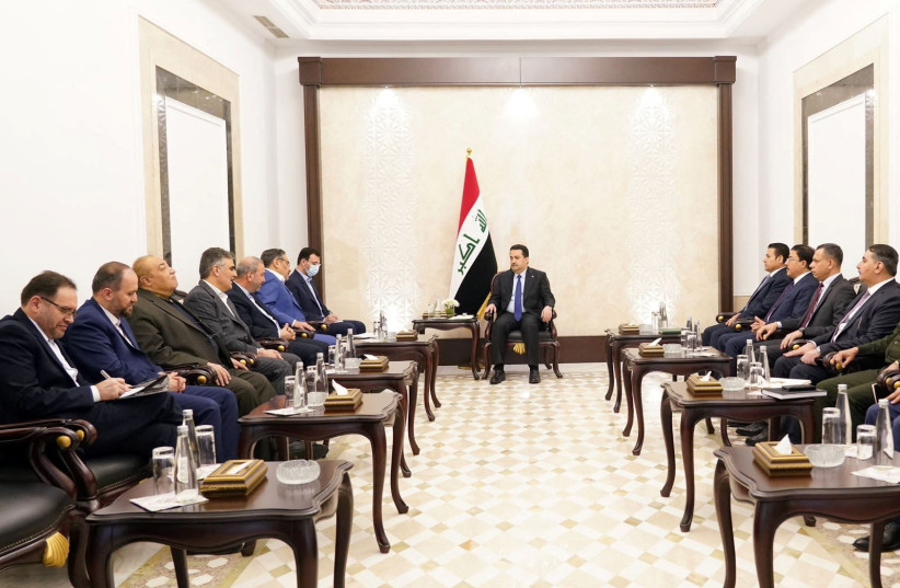 Iraqi Prime Minister Mohammed Shia al-Sudani meets with Iran's Supreme National Security Council secretary Ali Shamkhani, in Baghdad, Iraq, March 19, 2023. (credit: IRAQI PRIME MINISTER MEDIA OFFICE/HANDOUT VIA REUTERS)