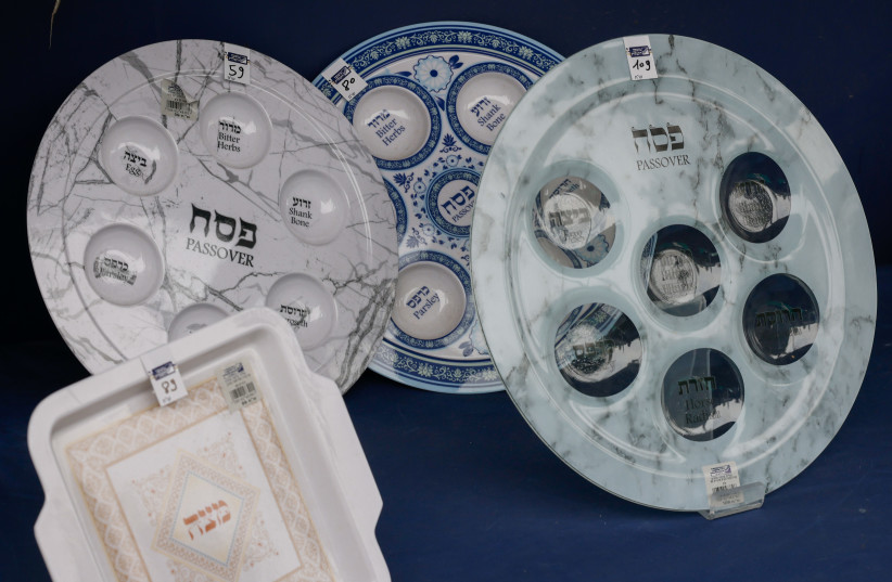 A Passover Seder plate is seen in this illustrative photo taken March 22, 2023 (credit: MARC ISRAEL SELLEM/THE JERUSALEM POST)
