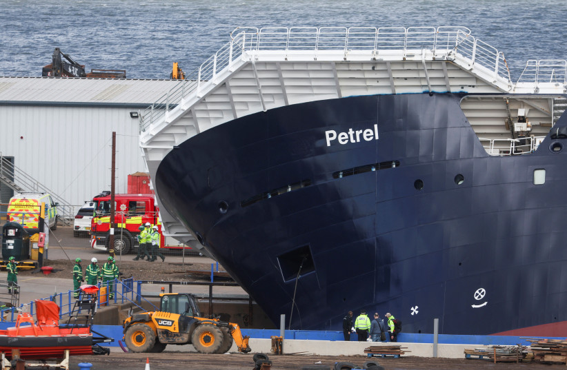View of the research vessel Petrel after it toppled over in a dry dock in Leith, near Edinburgh, Scotland, Britain, March 22, 2023. (credit: REUTERS/RUSSELL CHEYNE)