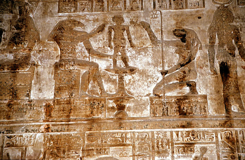 Khnum, accompanied by the goddess Heqet, moulds Ihy in a relief from the mammisi (birth temple) at Dendera Temple complex, Egypt (credit: ROLAND UNGER/CC BY-SA 3.0 (https://creativecommons.org/licenses/by-sa/3.0)/VIA WIKIMEDIA COMMONS)