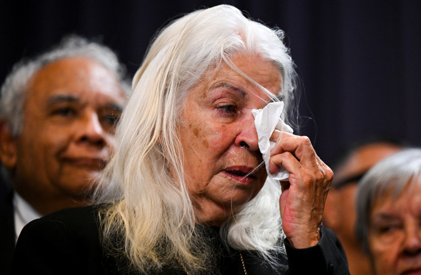  A member of the First Nations Referendum Working Group Marcia Langton reacts as she listens to Australian Prime Minister Anthony Albanese speak to the media during a news conference at Parliament House in Canberra, March 23, 2023. (credit: AAP Image/Lukas Coch via REUTERS)