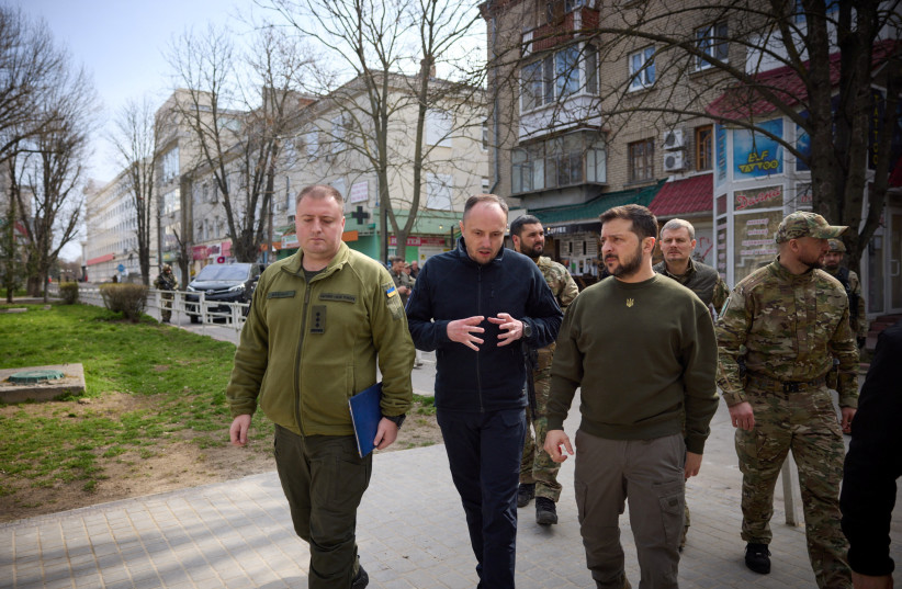  Ukraine's President Volodymyr Zelenskiy walks along a street, amid Russia's attack on Ukraine, as he visits Kherson, Ukraine March 23, 2023.  (credit: UKRAINIAN PRESIDENTIAL PRESS SERVICE/REUTERS)