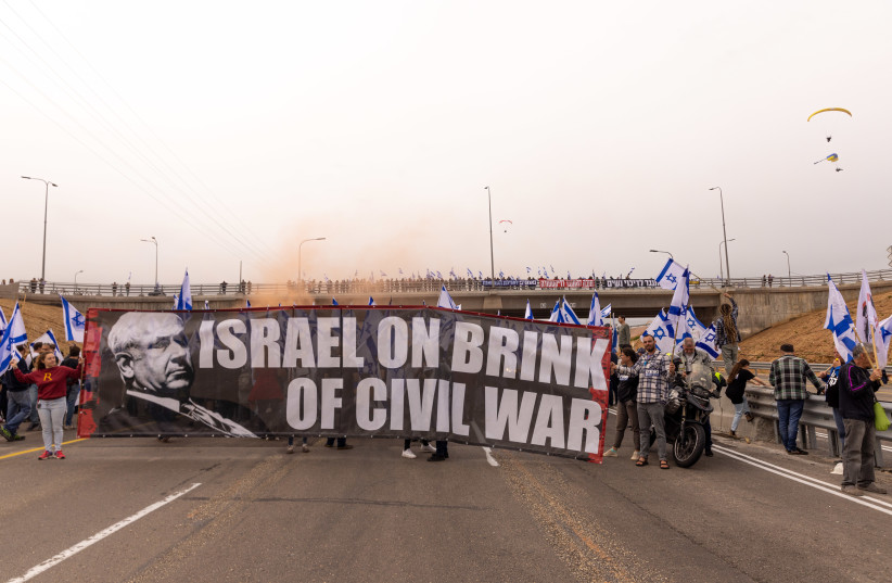  A convoy of motorcycles with Israeli flags as part of a protest against the planned judicial overhaul, in Herzliya, on March 23, 2023.  (credit:  YOSSI ALONI/FLASH90)