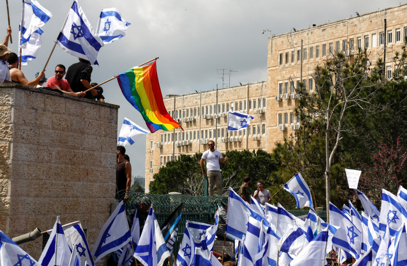 Israeli protesters attending a demonstration against the Israeli government's judicial overhaul, in Jerusalem, March 27, 2023 (credit: AMMAR AWAD/REUTERS)