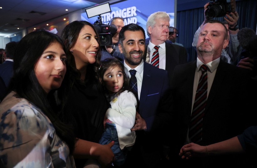  Humza Yousaf poses for a picture after being announced as the new Scottish National Party leader in Edinburgh, Britain March 27, 2023.  (credit: REUTERS/RUSSELL CHEYNE)