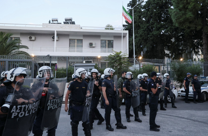  Riot police stand guard outside the Iranian Embassy, during a protest following the death of Mahsa Amini, in Athens, Greece, September 22, 2022. (credit: COSTAS BALTAS / REUTERS)
