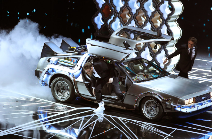  89th Academy Awards - Oscars Awards Show - Seth Rogan and Michael J. Fox arrive onstage in a DeLorean to present the award for Best Film Editing. (credit: LUCY NICHOLSON / REUTERS)