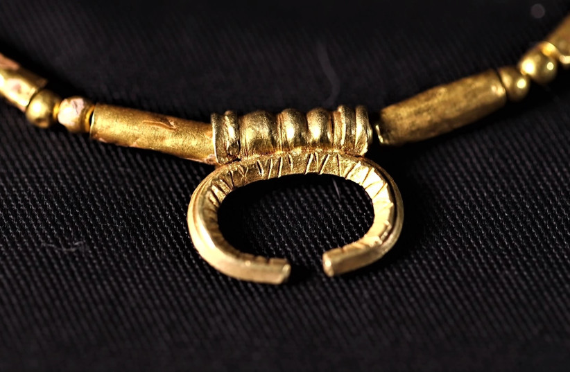  A pendant with the sign of Luna, Roman goddess of the moon. (credit: EMIL ALADJEM/IAA)