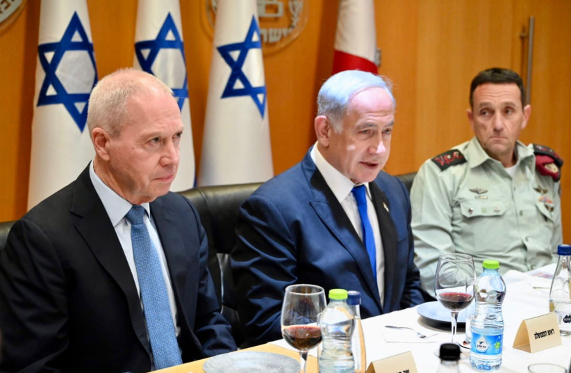 Defense Minister Yoav Gallant, Prime Minister Benjamin Netanyahu and IDF Chief of Staff Herzi Halevi attend a Passover celebration on Tuesday April 4, 2023.  (credit: ARIEL HERMONI/DEFENSE MINISTRY)