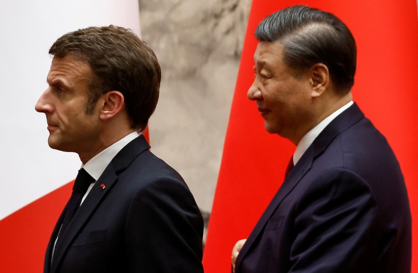  Chinese President Xi Jinping and French President Emmanuel Macron look on at the Great Hall of the People, in Beijing, China, April 6, 2023 (credit: REUTERS/GONZALO FUENTES)