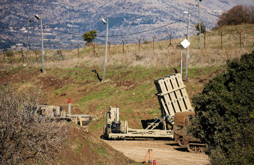  An Iron Dome anti-missile system is seen near the border area between Israel and Syria, in the Golan Heights November 18, 2020 (credit: REUTERS/Hamad Almakt)