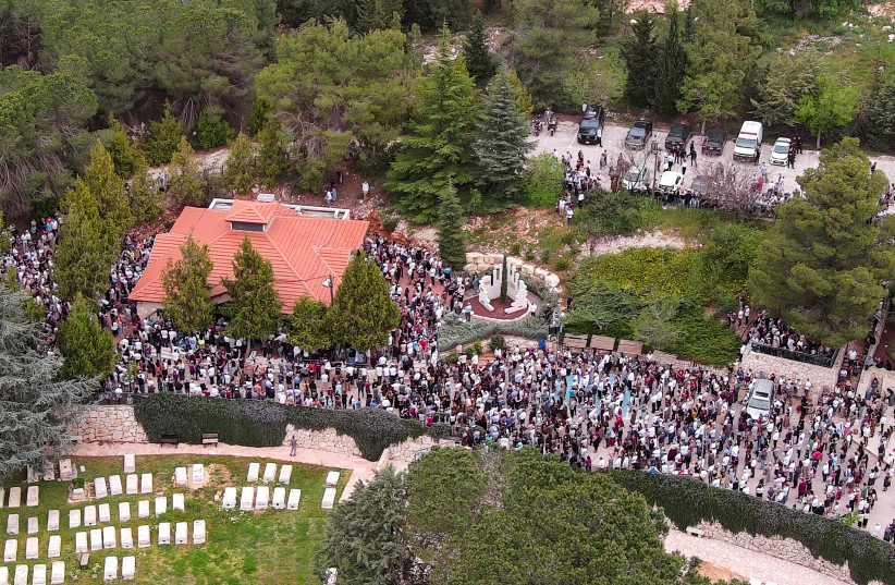  An aerial view shows friends and family of Maia and Rina Dee, Israeli-British sisters killed in a shooting attack, as they attend their funerals at a cemetery in Kfar Etzion in the West Bank, April 9, 2023. (credit: ILAN ROSENBERG/REUTERS)