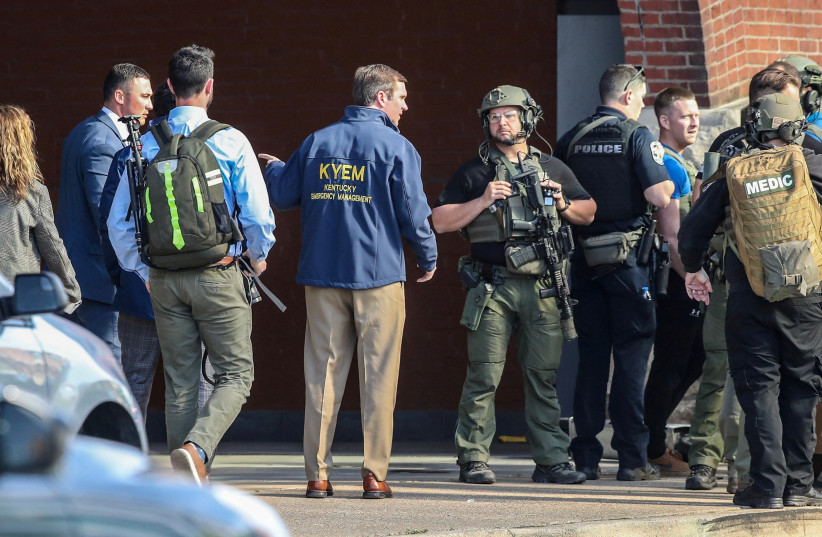  Kentucky Governor Andy Beshear speaks with police deploying at the scene of a mass shooting near Slugger Field baseball stadium in downtown Louisville, Kentucky, U.S. April, 10, 2023 (credit: Michael Clevenger/USA Today Network via REUTERS)