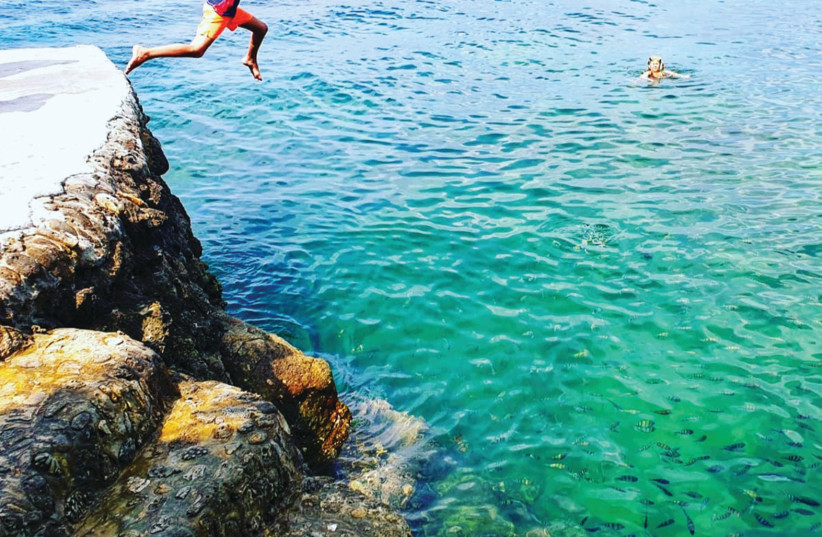 JUMPING OFF rocks in Thailand. (credit: OLO - Only Live Once/World-traveling influencers, content creators & PR agency)