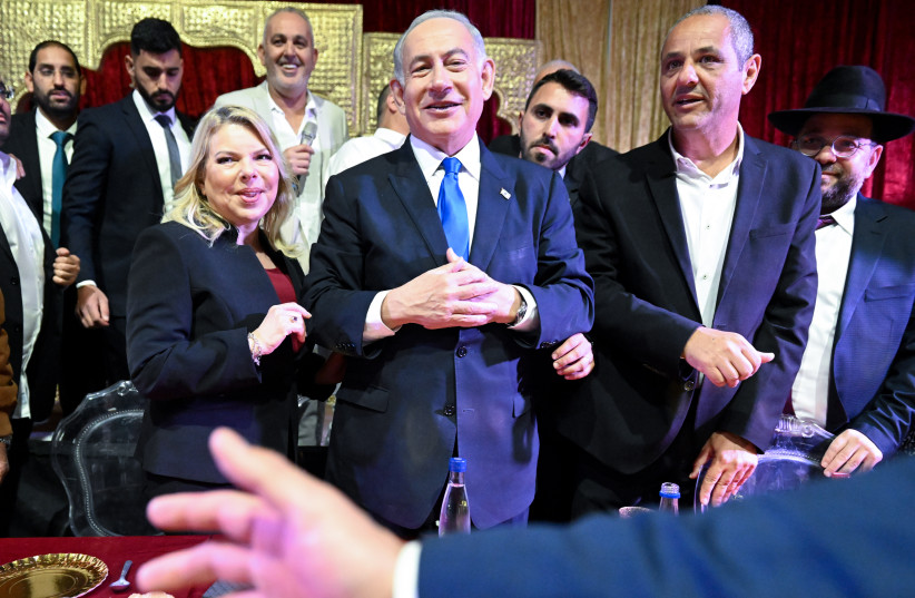  Prime Minister Benjamin Netanyau and his wife Sara attend the Jewish Maroccan celebration of Mimuna, in Hadera on April 12, 2023.  (credit: RAMI SHLLUSH/POOL)