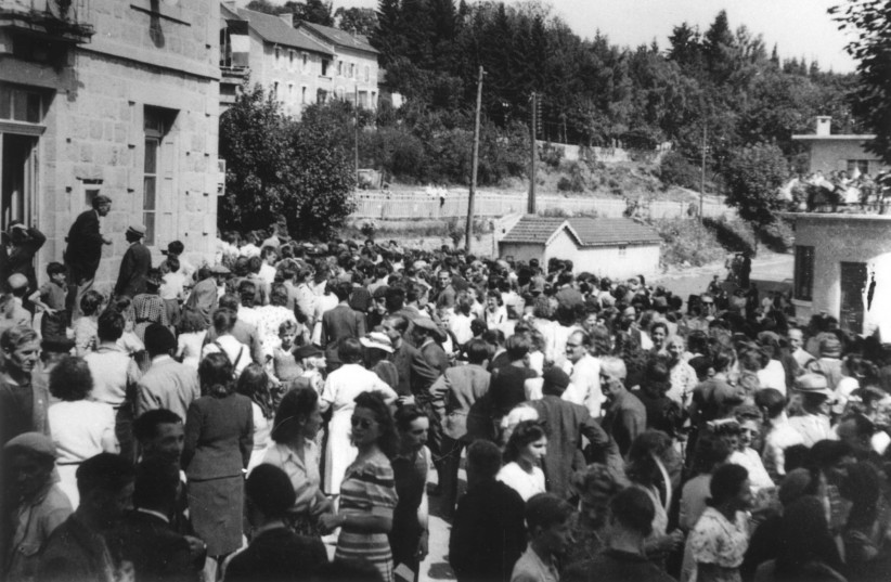  Le Chambon Sur Lignon, France, Surviving residents celebrating the liberation in the main square of the town, 1944. (credit: YAD VASHEM)