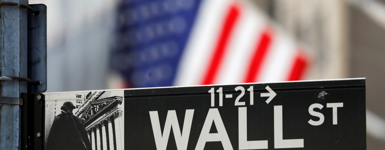  A street sign for Wall Street is seen outside the New York Stock Exchange (NYSE) in New York City, New York, US, July 19, 2021.