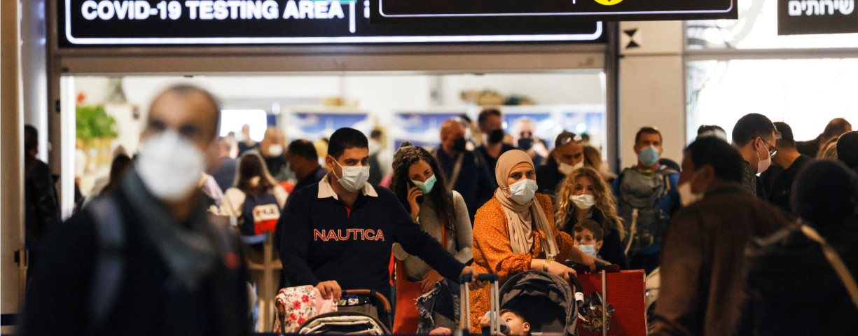  Travelers exit the coronavirus disease (COVID-19) pandemic testing area at Ben Gurion International Airport as Israel imposes new restrictions on November 28, 2021.