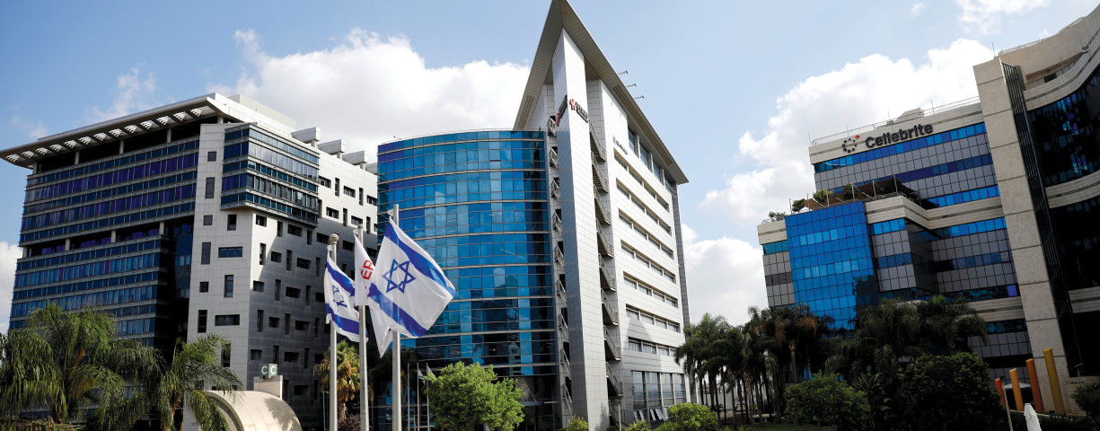  Israeli flags flutter at a business park housing hi-tech companies, at Ofer Park in Petah Tikva.