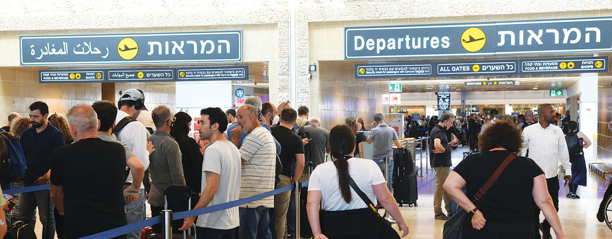  PASSENGERS AT Ben-Gurion Airport get ready to leave Israel. 