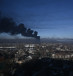  Black smoke rises from a military airport in Chuguyev near Kharkiv on February 24, 2022.