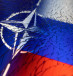 NATO and Russian flags are seen through broken glass this illustration taken April 13, 2022.